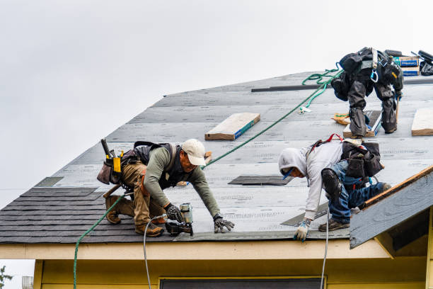 Professional Storm Damage Roof Repair technician working in Claremont, NH